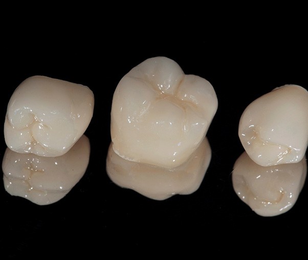 Dental crowns on a black background