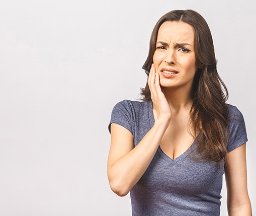 Concerned woman experiencing dental pain